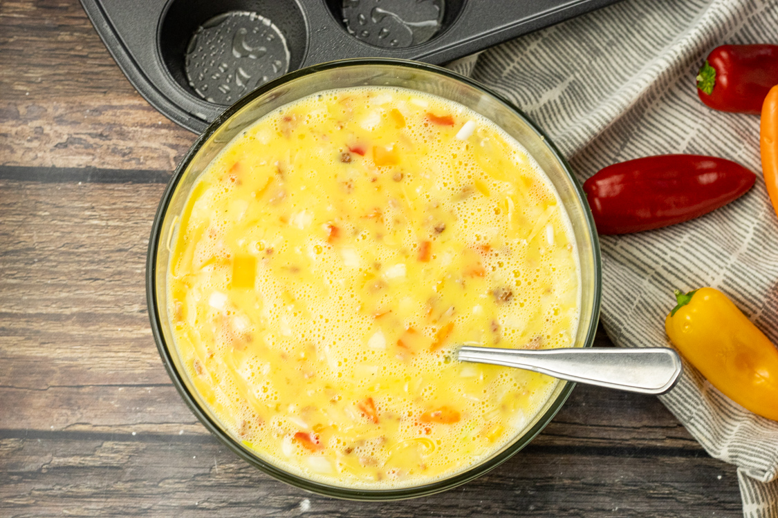 mixture of eggs, peppers, bacon, onions and cheese