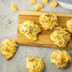 cheddar bay biscuits on a wooden platter