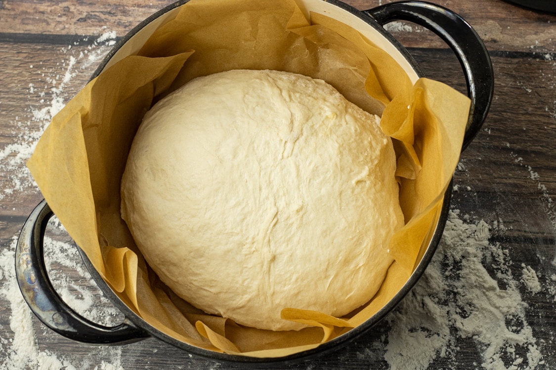 no knead dutch oven bread recipe in a parchment lined pan