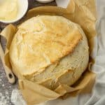round loaf of bread in parchment paper