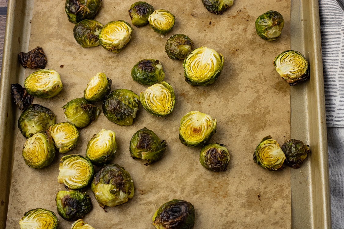 roasted brussel sprouts on a baking sheet
