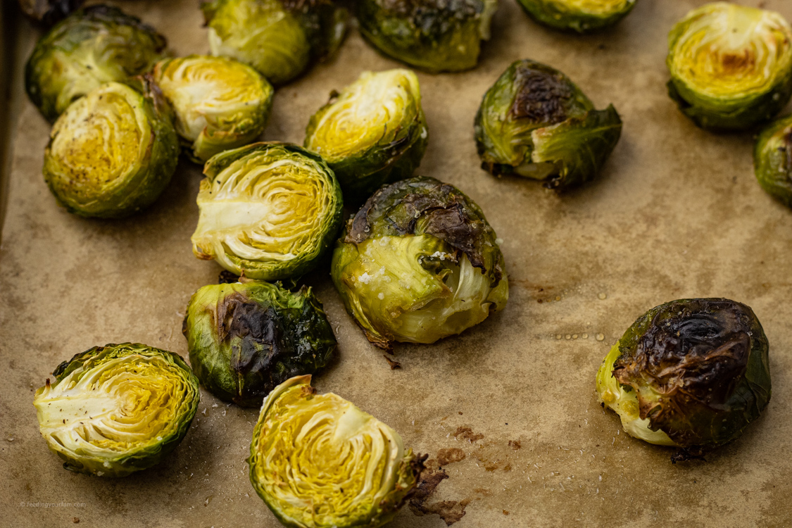 oven baked brussel sprouts on a baking sheet