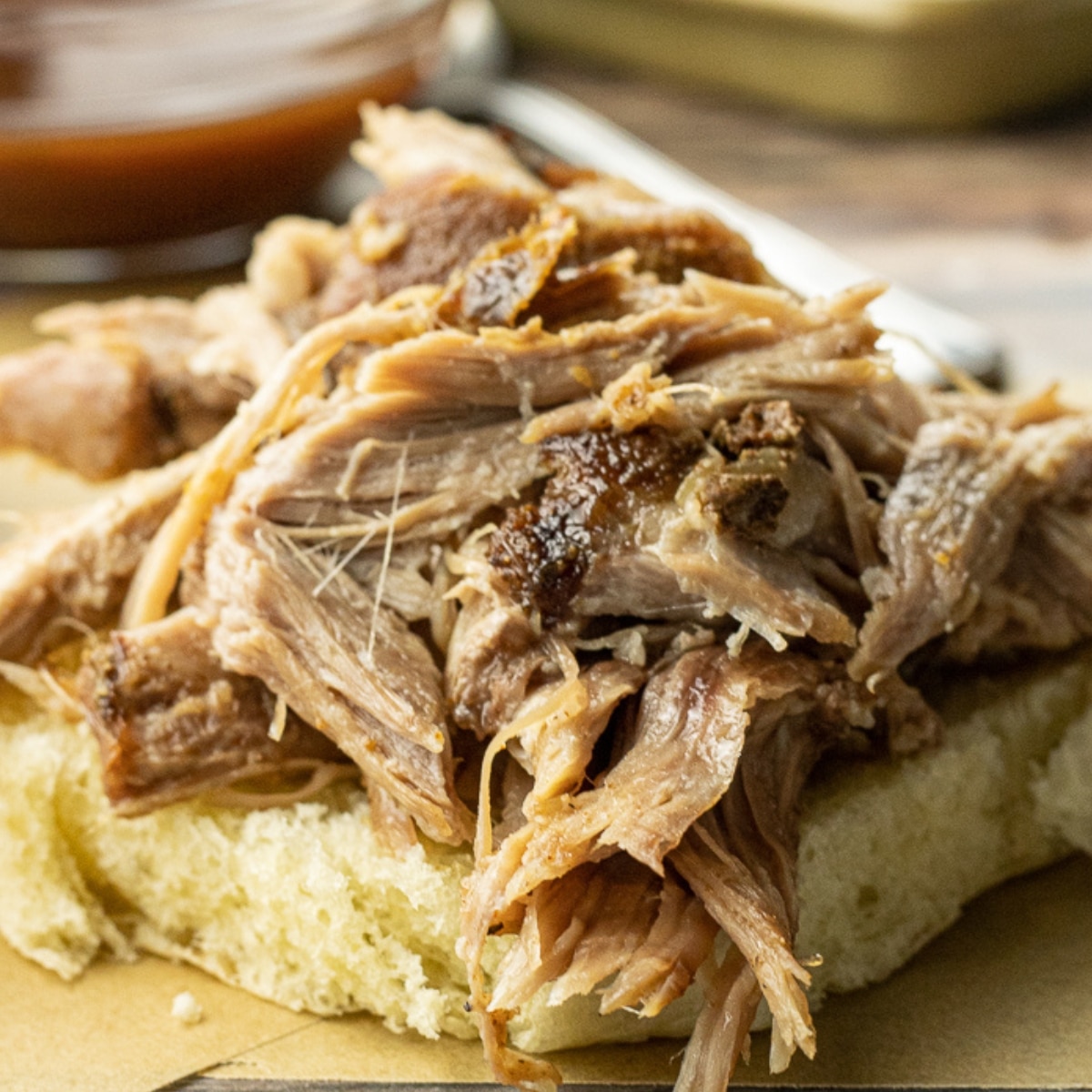 pulled pork on the bottom half of a bun