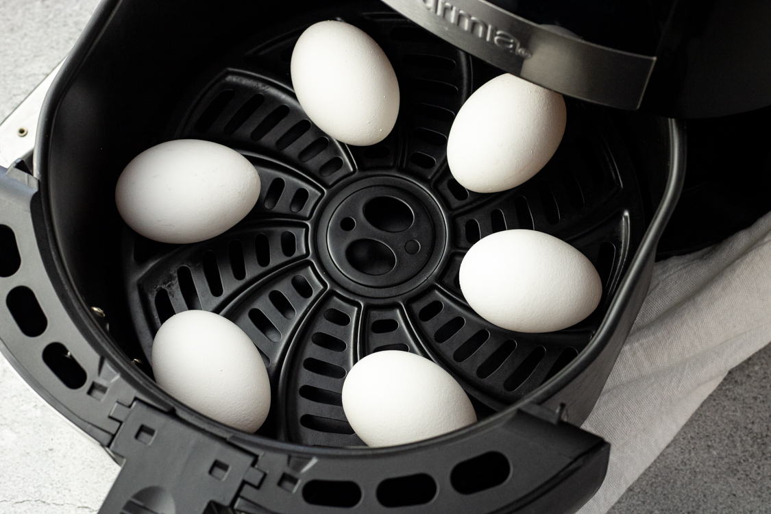 eggs in the basket of an air fryer