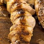 sliced pork tenderloin drizzled with balsamic vinegar