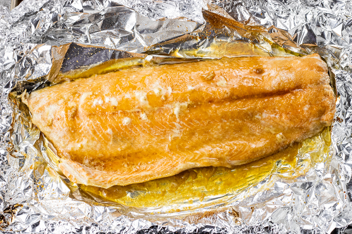 salmon on foil with melted butter and brown sugar
