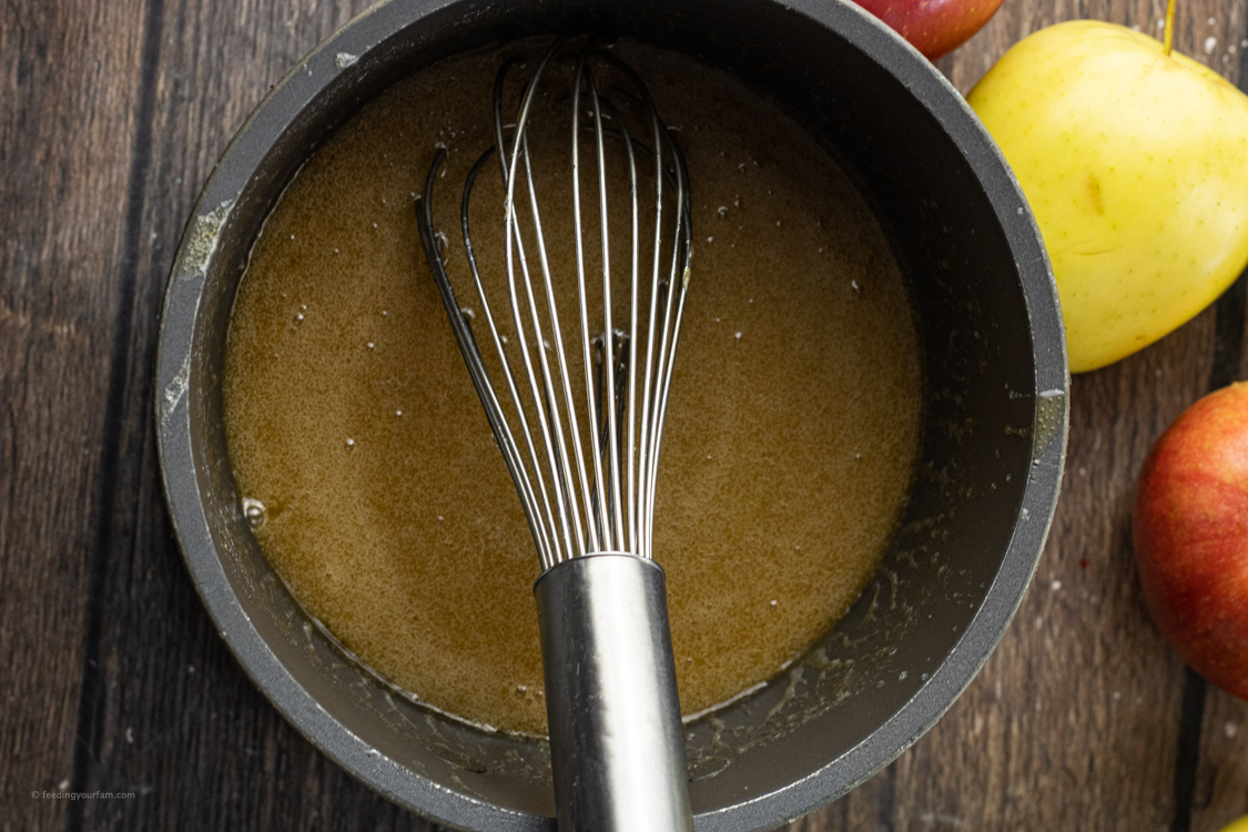 stirring caramel with a whisk