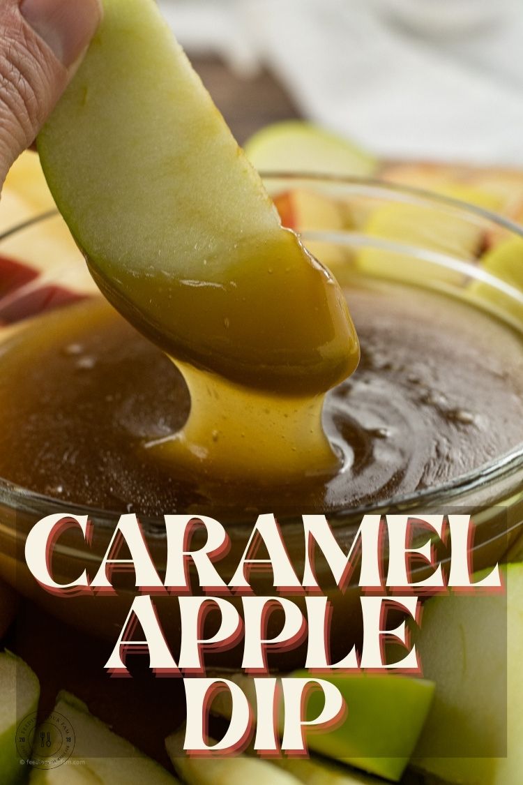 dipping a slice of apple into caramel sauce