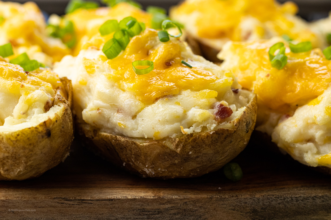 image of cheese covered baked potatoes