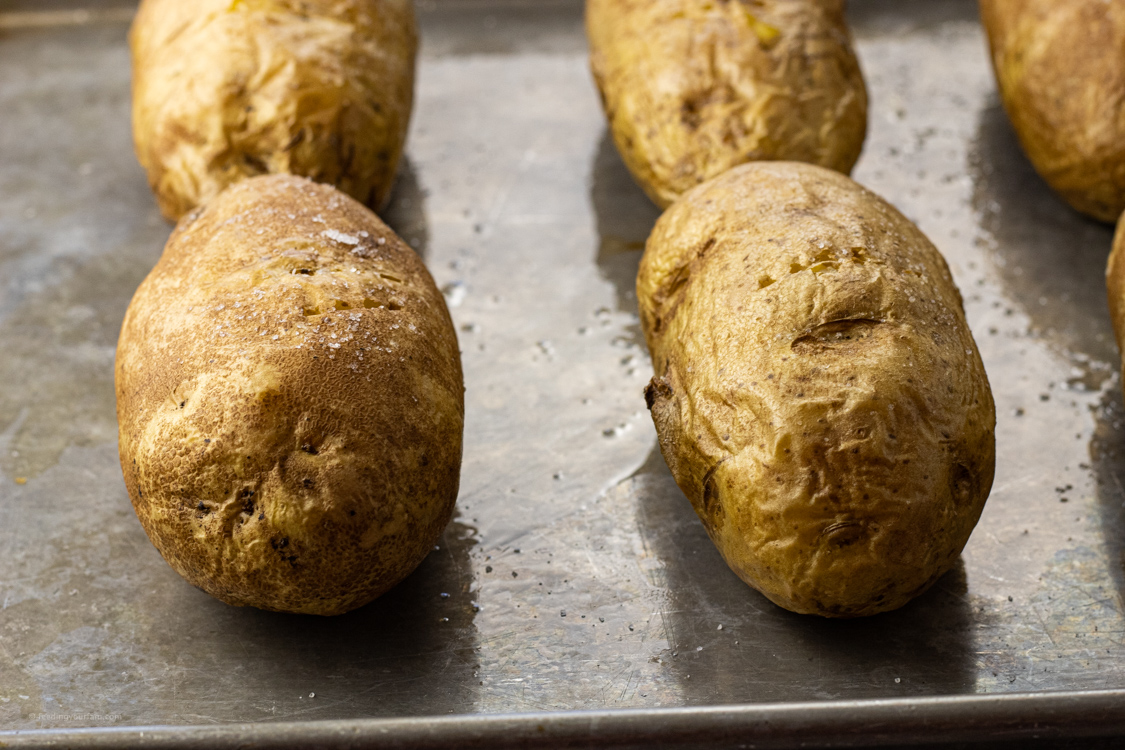 baked potatoes on a baking sheet