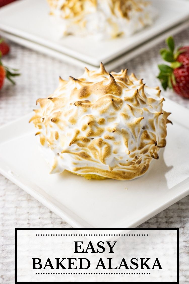 Baked Alaska is a delicious dessert filled with cake, strawberries and vanilla ice cream all topped with a delicious toasted meringue. 