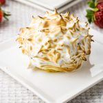 small baked alaska on a white plate