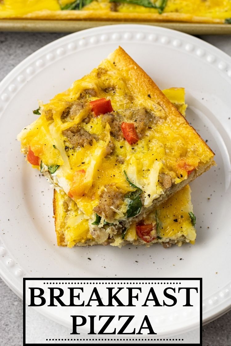 Breakfast Pizza is a simple one pan breakfast idea that has a crescent roll crust topped with eggs, sausage, cheese, hash browns, peppers and spinach. This breakfast pizza recipe is perfect for a simple breakfast for the fam or make a batch for brunch with friends. 