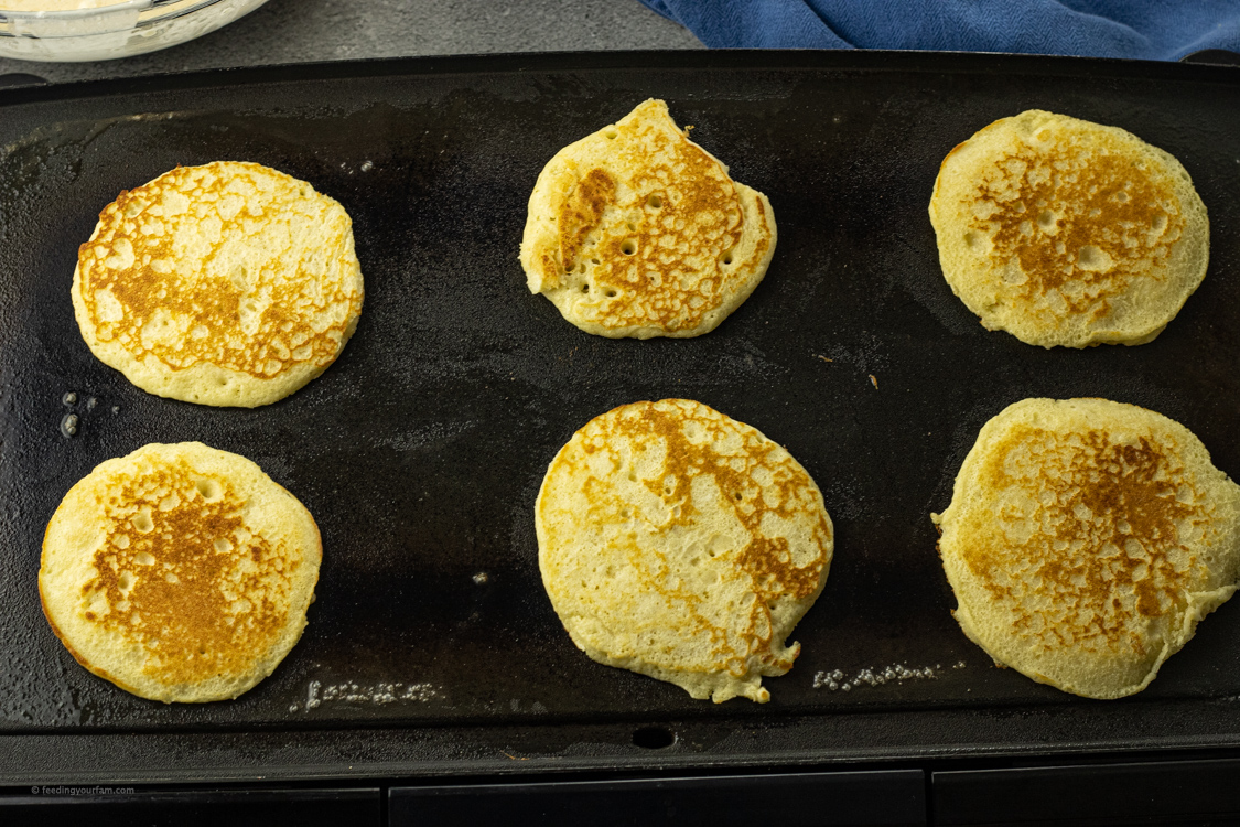cooking pancakes on a griddle
