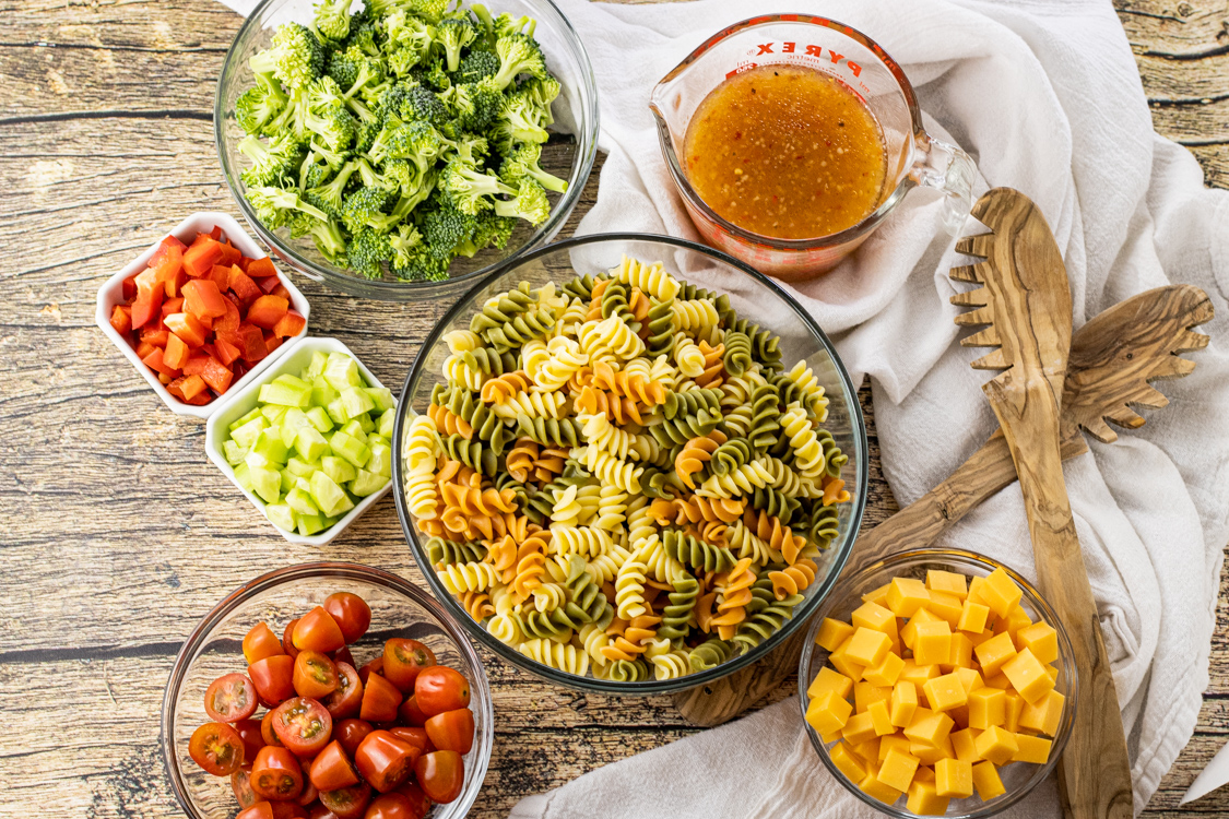 bowls of ingredients for pasta salad