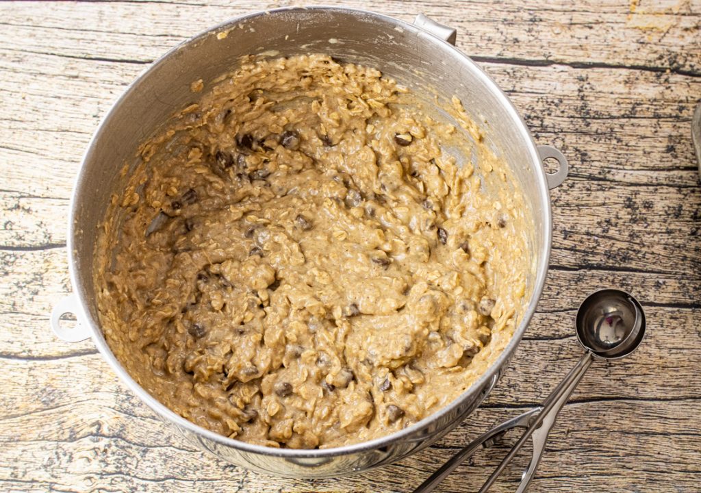 banana oatmeal cookie dough in a metal mixing bowl