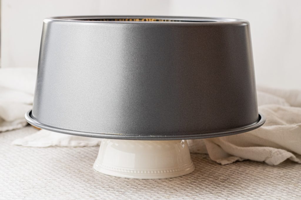 tube cake pan upside down on a small ramekin 