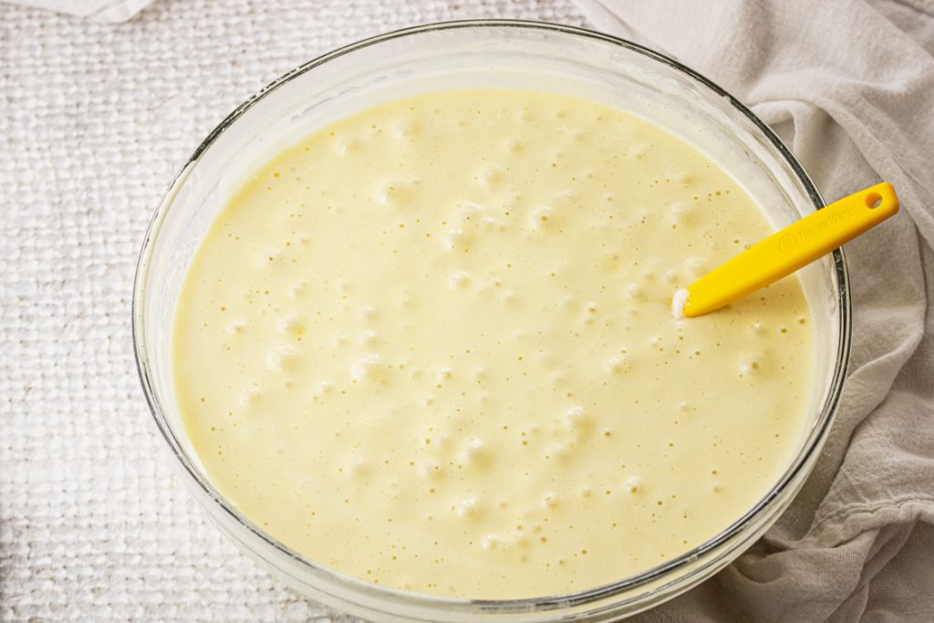 batter for chiffon cake in a glass mixing bowl