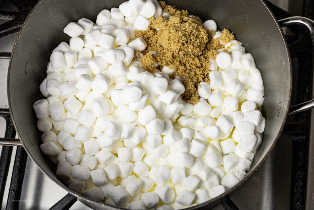 big pot with mini marshmallows, brown sugar and butter melting