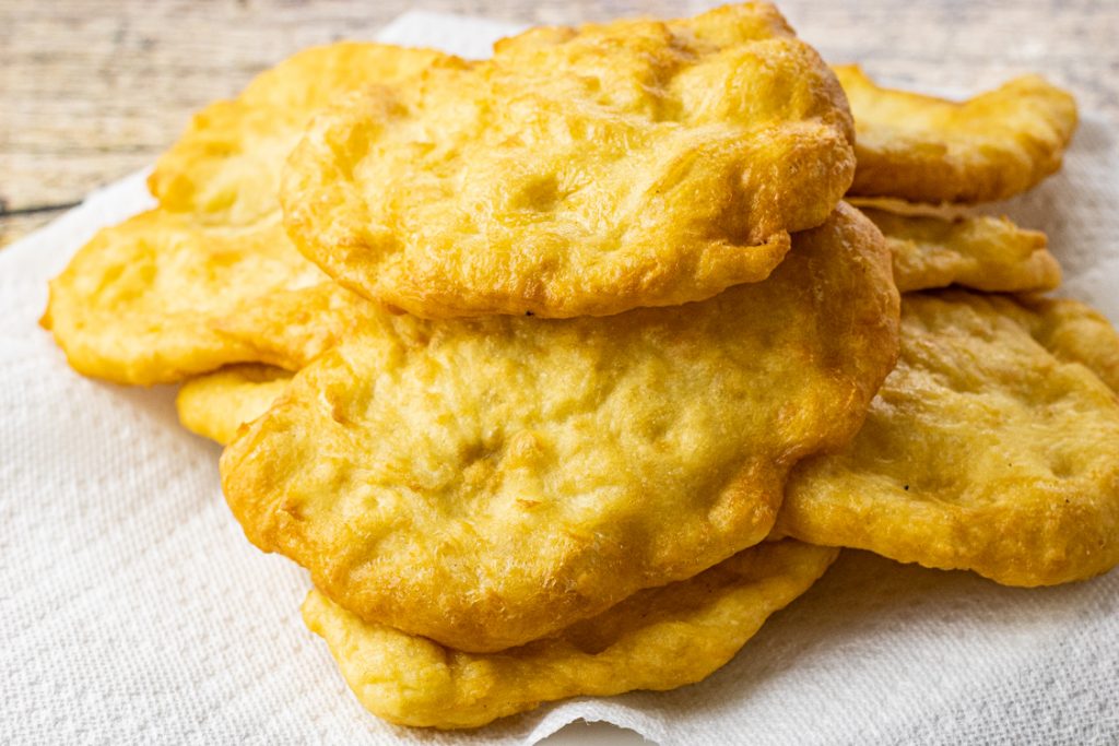 golden brown fried bread on a paper towel