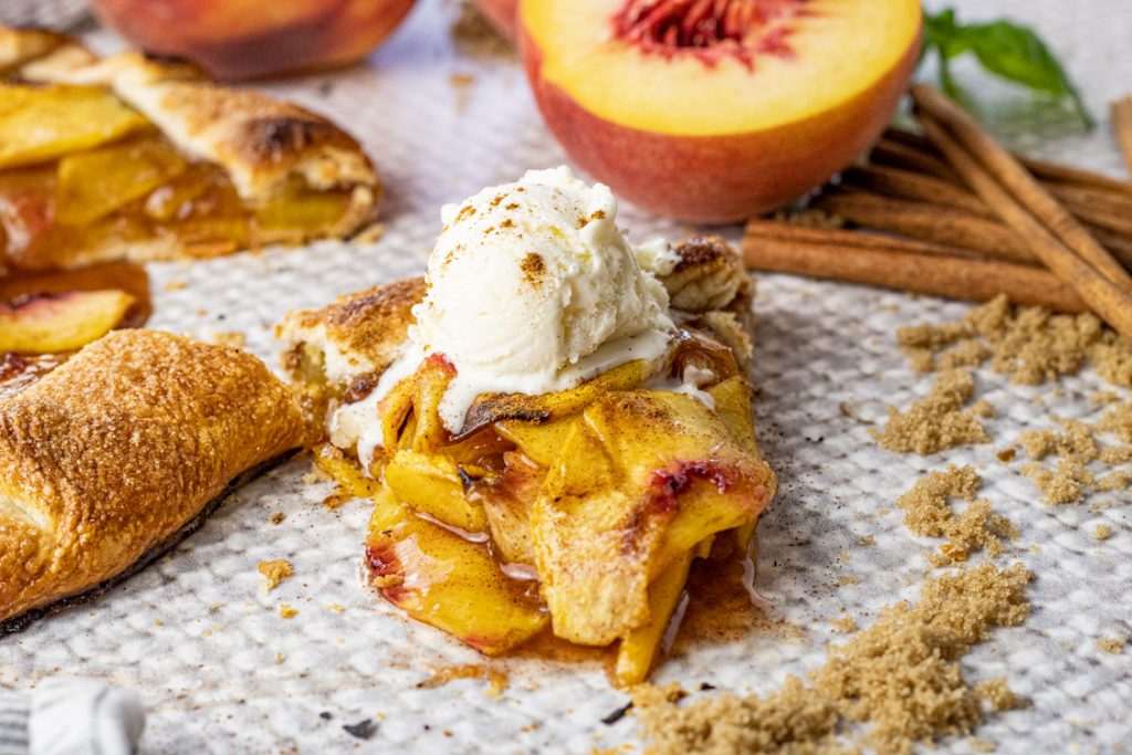 slice of sliced peaches topped with ice cream