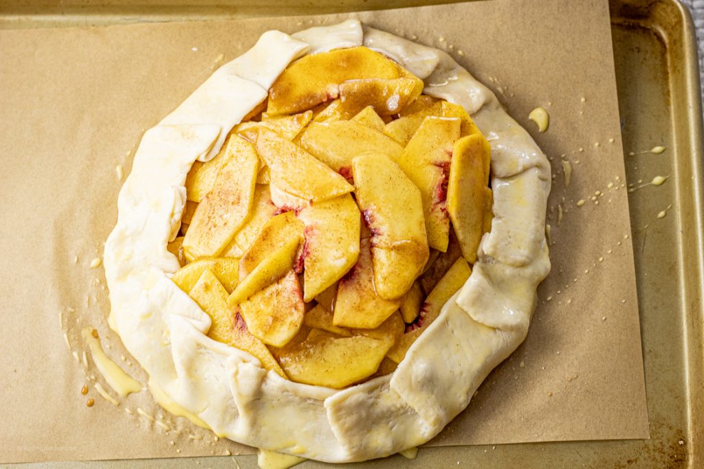 pie crust wrapped around sliced peaches