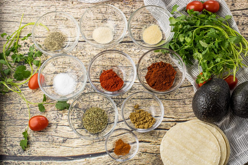 small glass bowls filled with spices