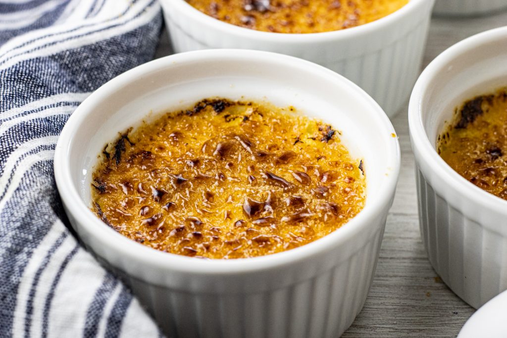 small ramekin of custard topped with torched sugar