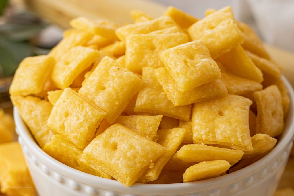 baked cheesy crackers in a white bowl