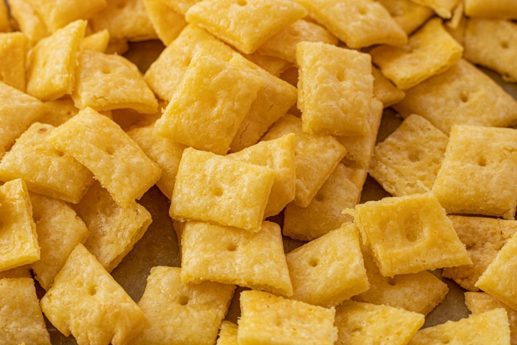 square cheese crackers with a small hole in the center