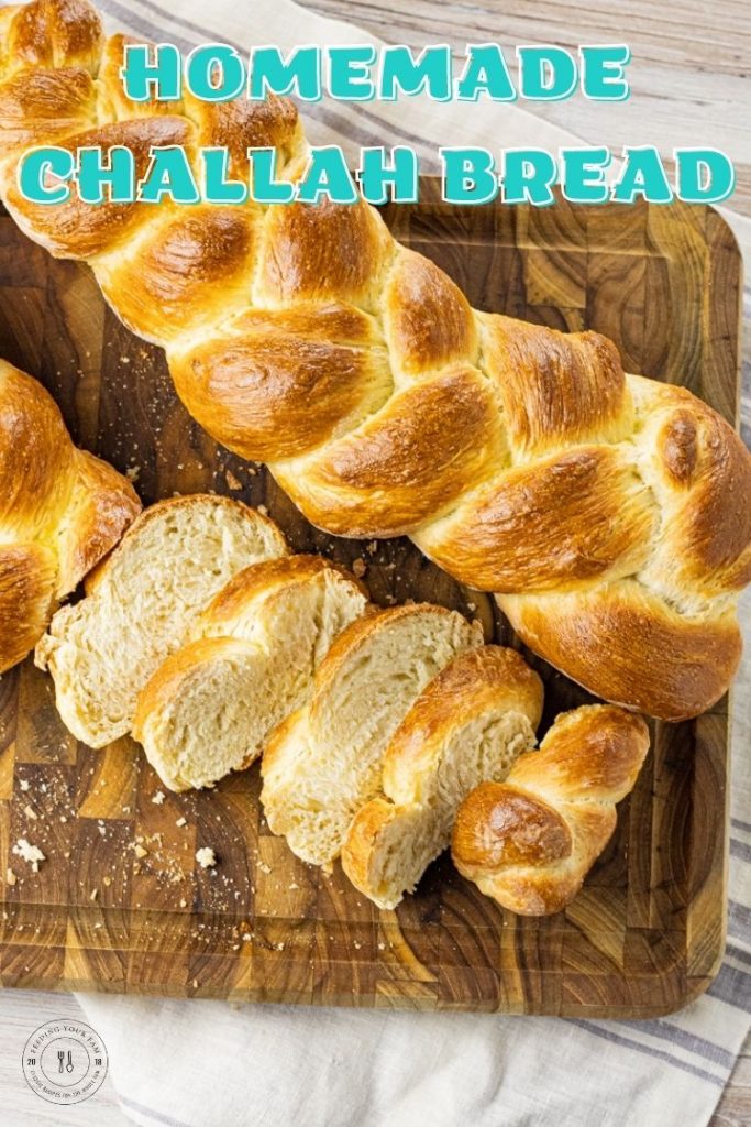 two braided loaves of bread on a wooden cutting board