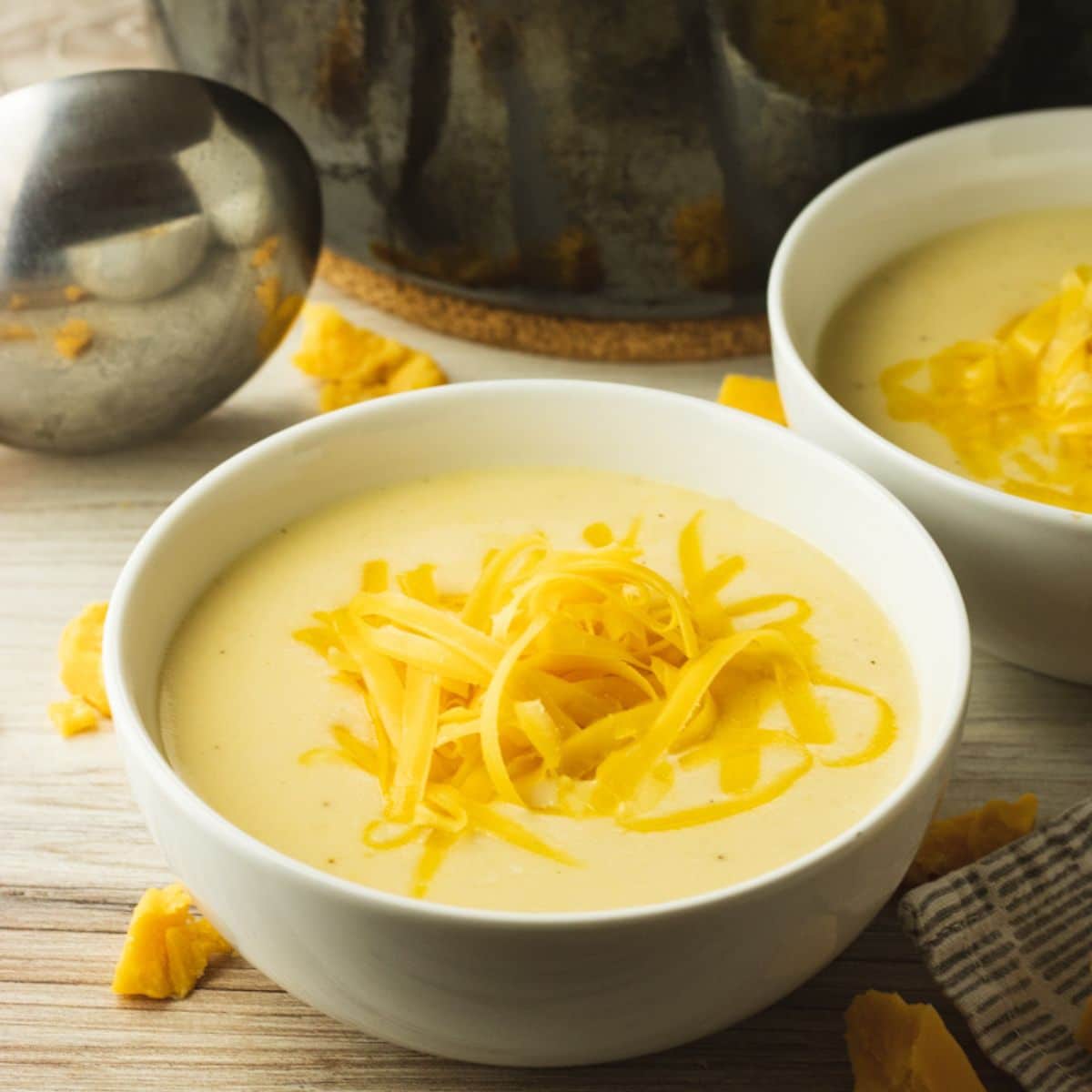 bowl of cauliflower cheese soup in a white bowl