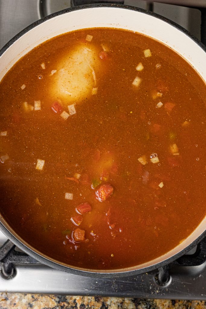 pot of tomato sauce and chicken broth
