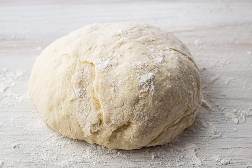 ball of dough dusted with flour