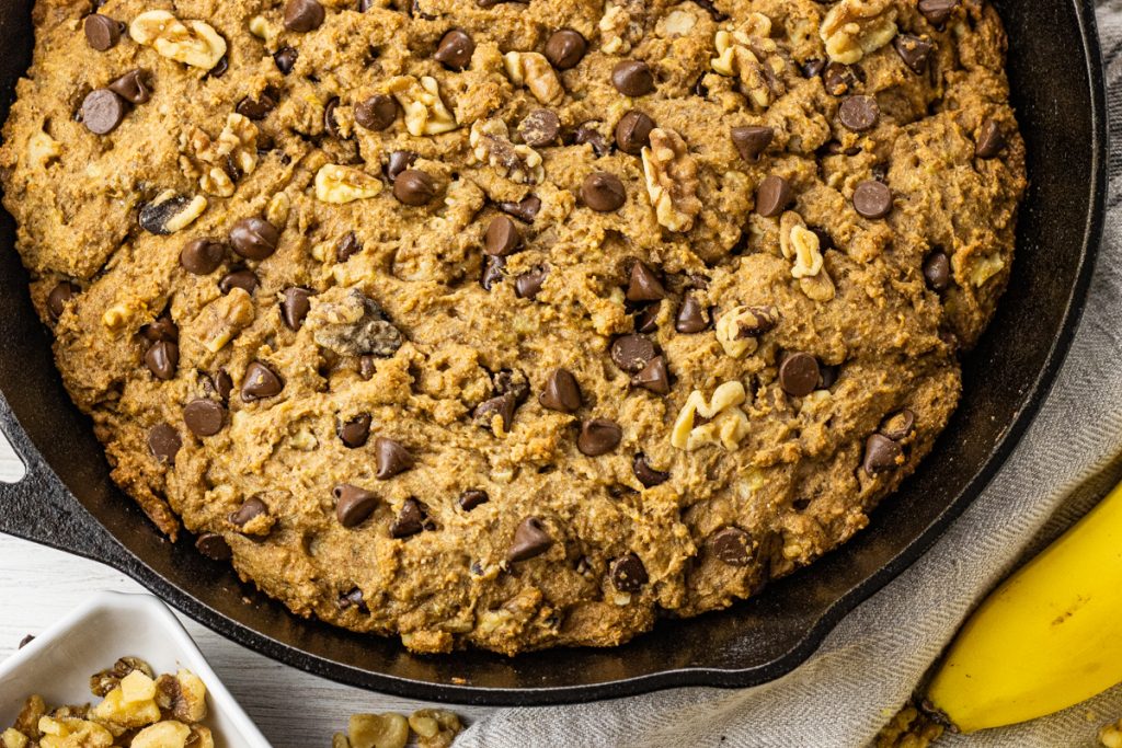pan of cooked chocolate chip banana bread in black cast iron pan