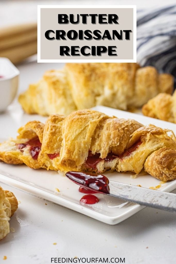 flaky croissant on a white plate