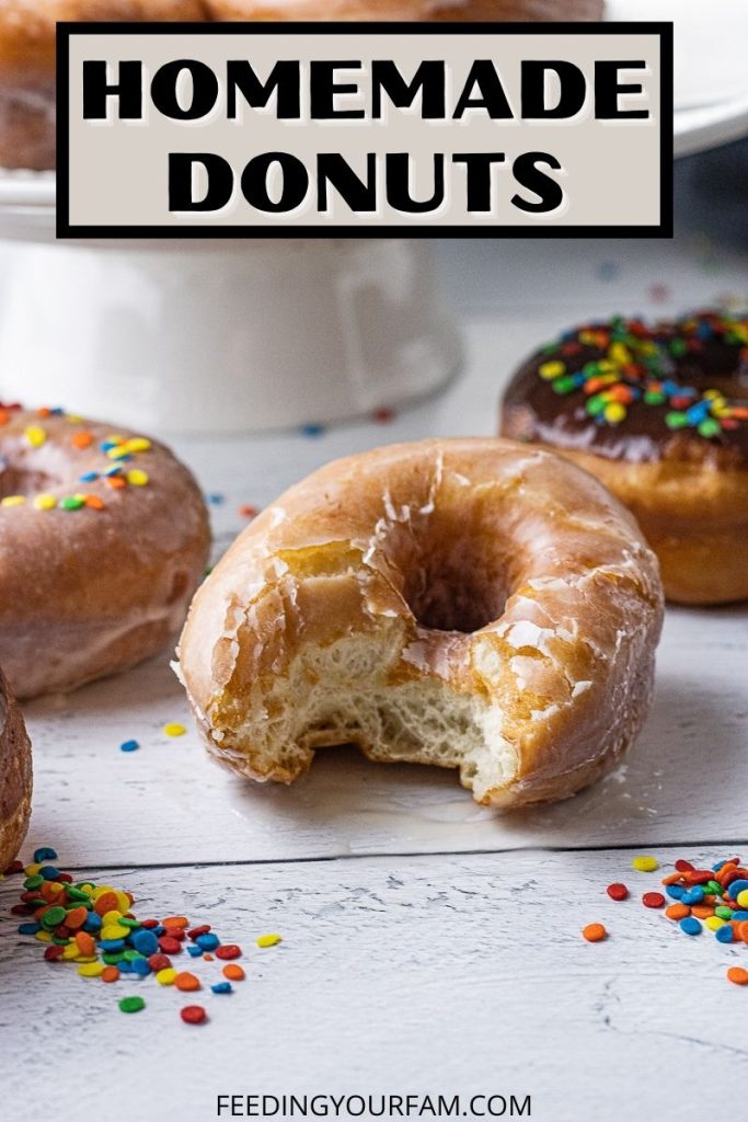 glazed donut with a bite out of it with the text homemade donuts above it