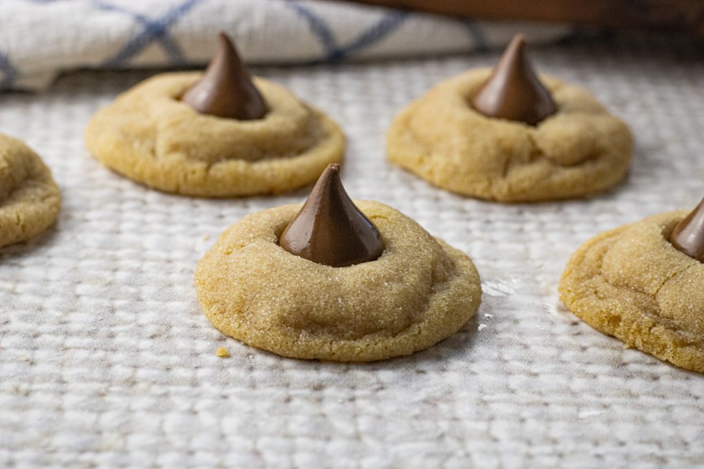peanut butter cookies topped with a chocolate kiss candy