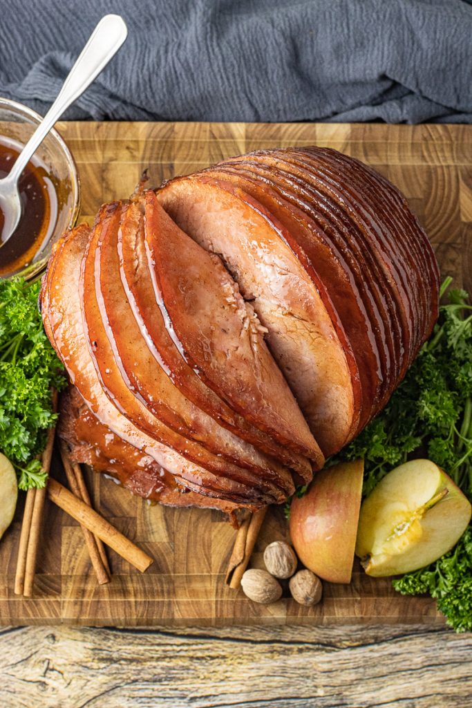 sliced ham on a wooden cutting board