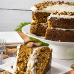 slice of carrot cake on a white square plate