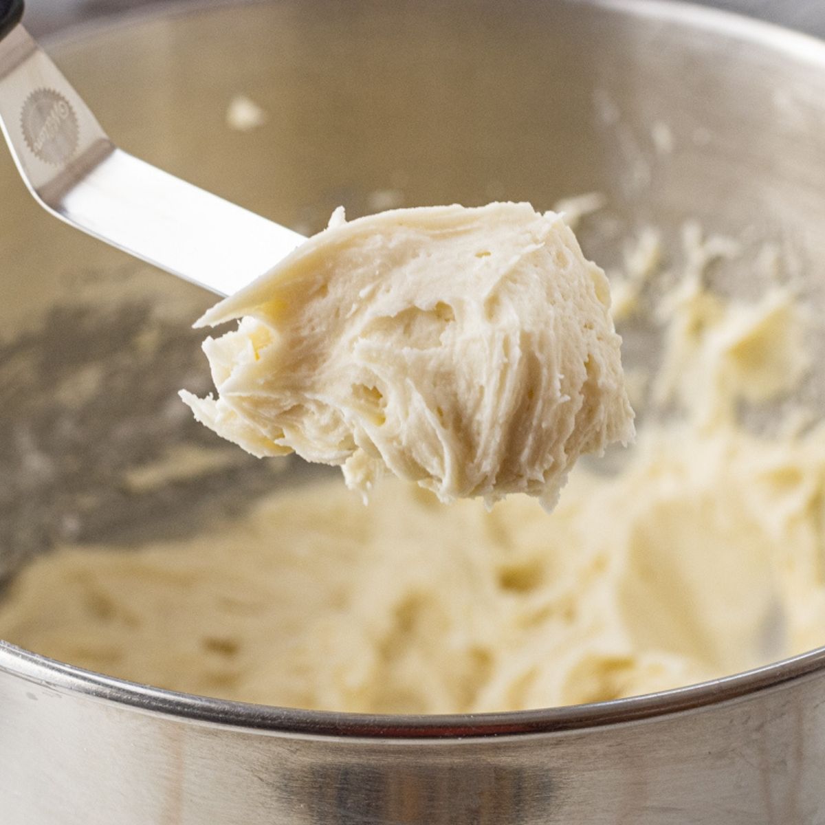spatula with a scoop of frosting