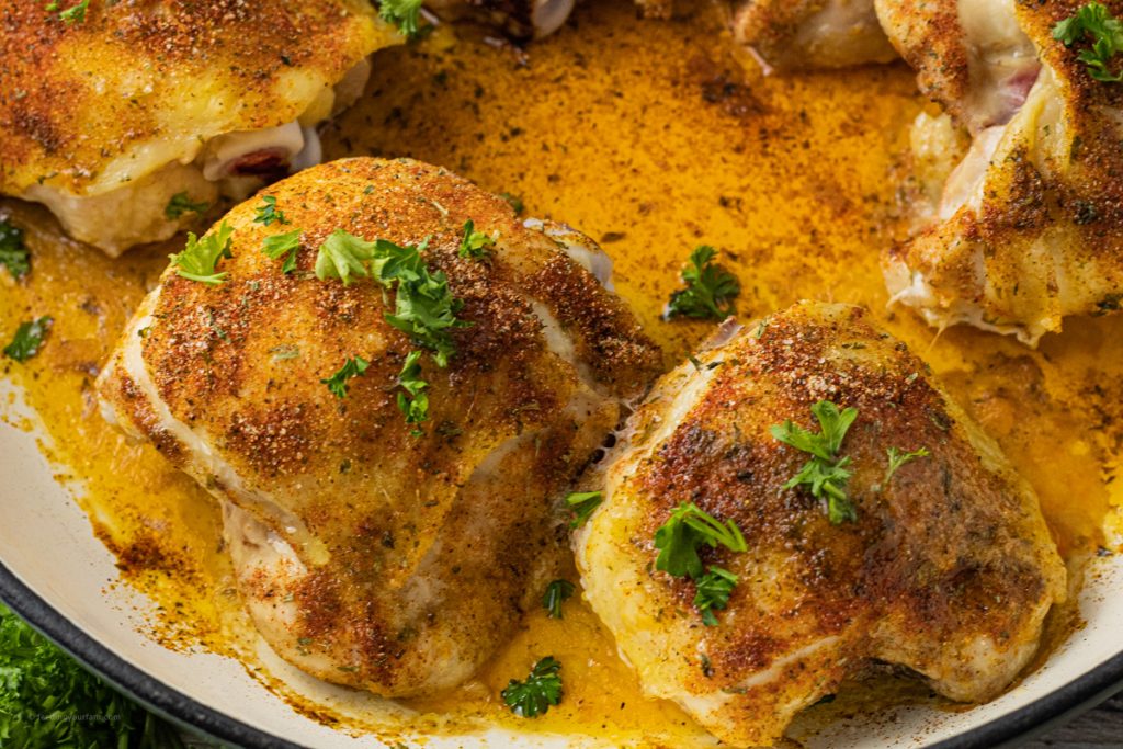 baked chicken thighs in a round pan