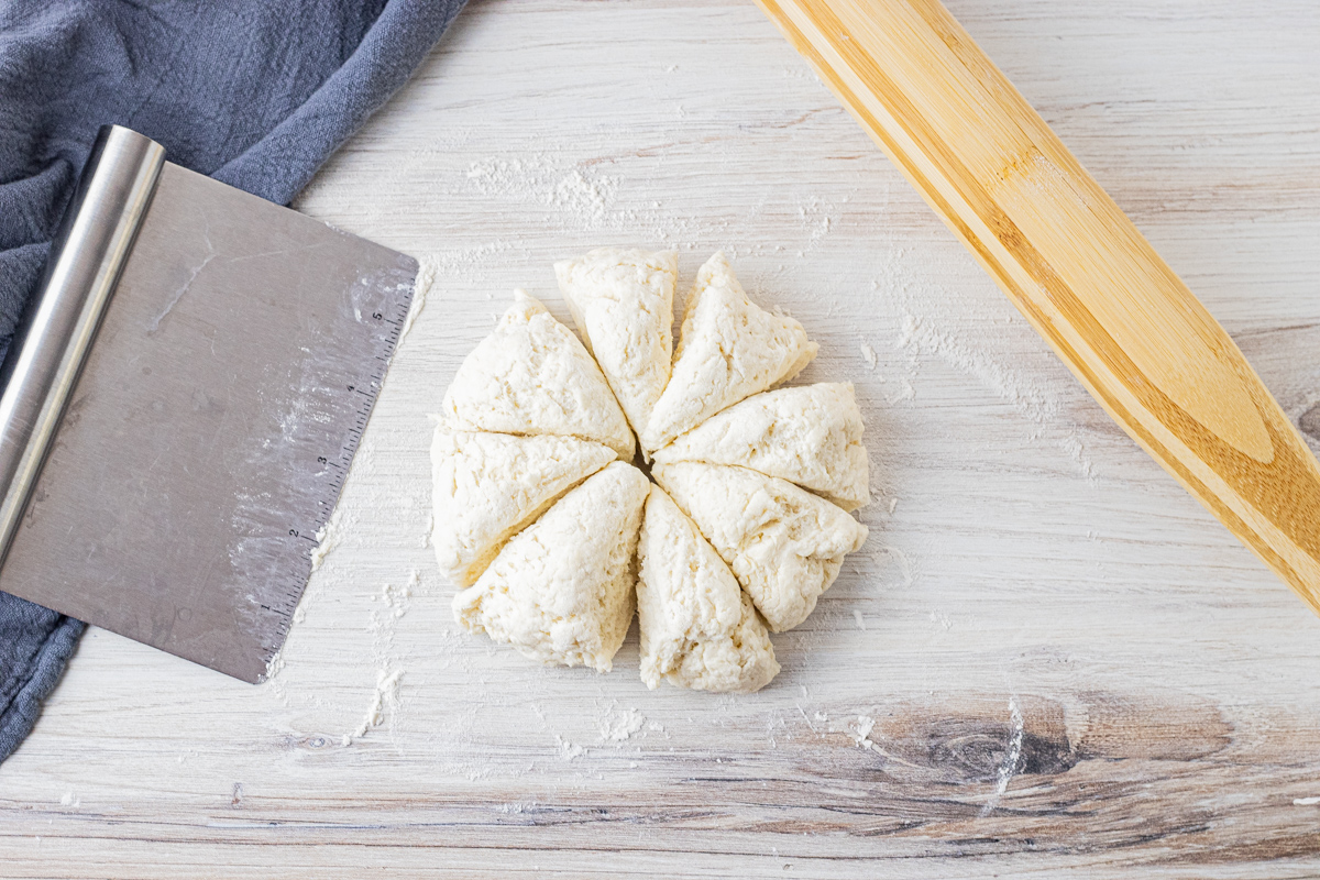 ball of dough sliced into 8 equal pieces