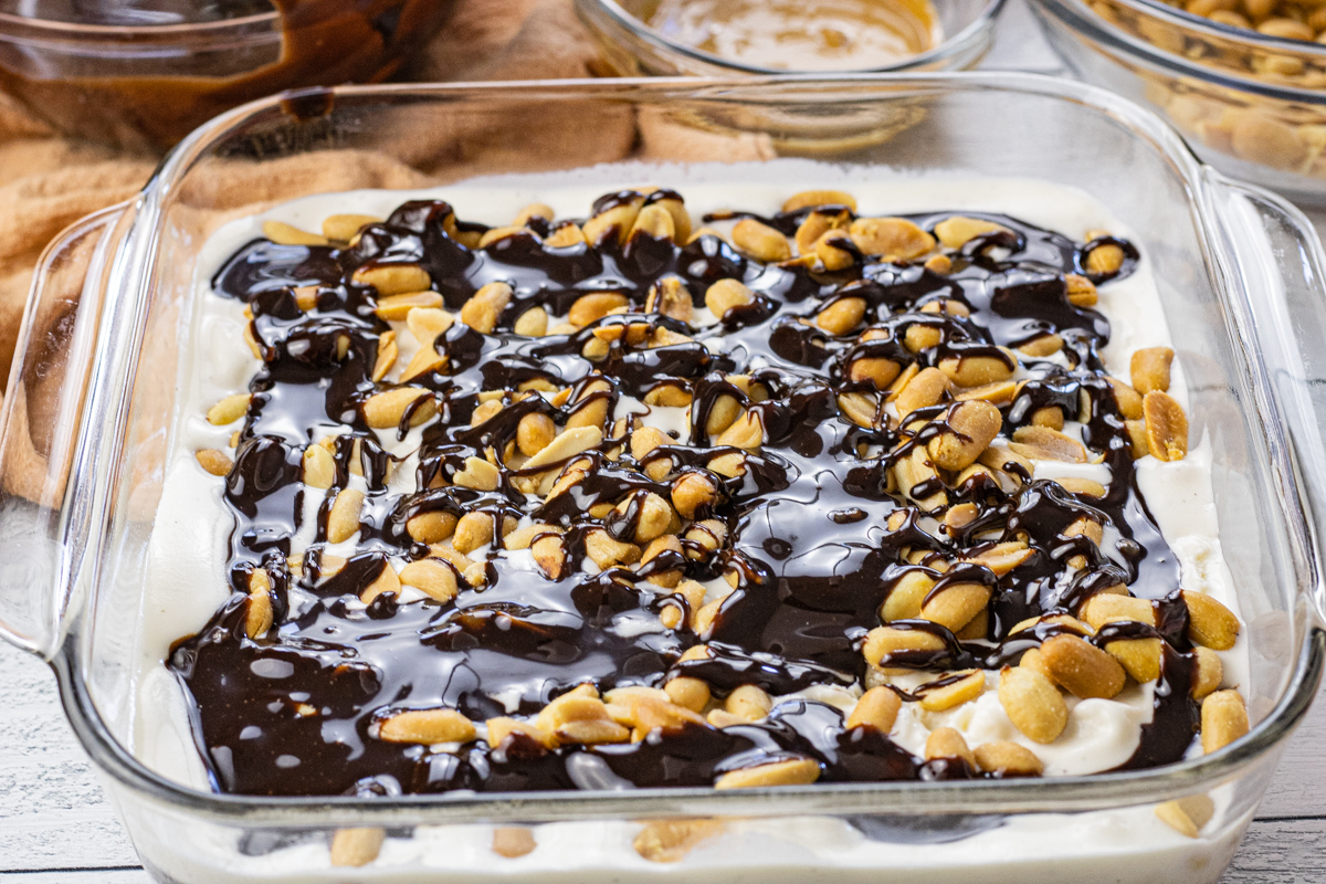layers of vanilla ice cream, peanuts and hot fudge