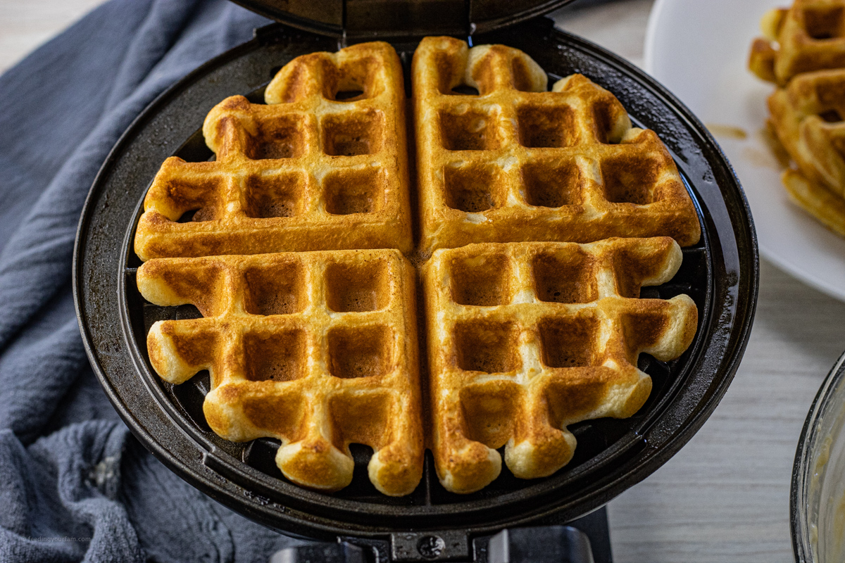 cooked waffle in a waffle iron