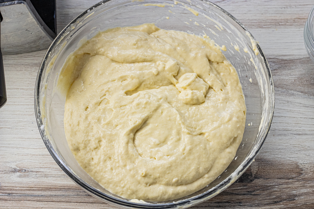waffle batter in a glass mixing bowl