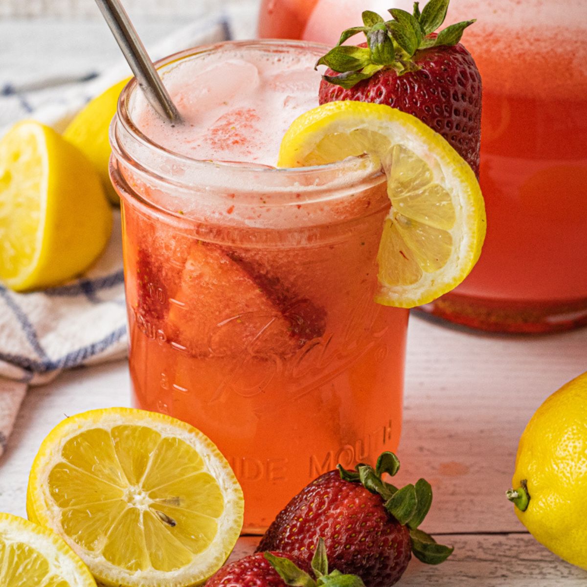 jar of lemonade with strawberries