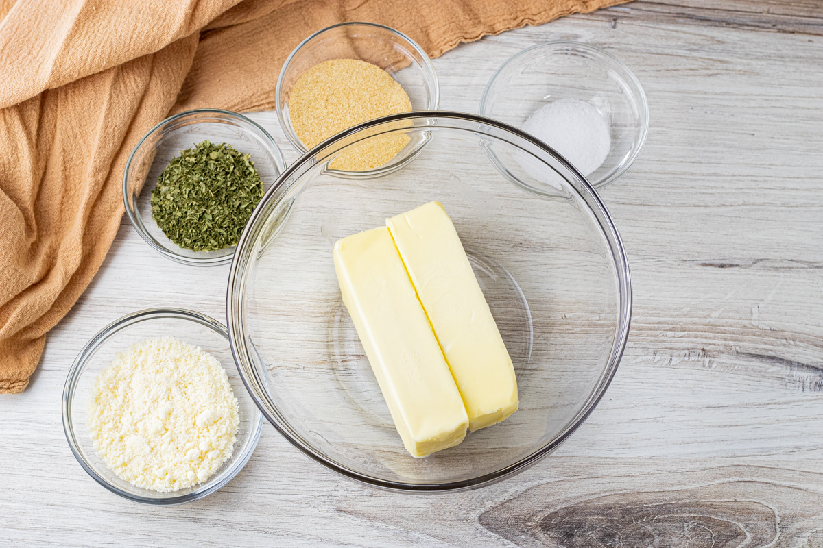 butter, parmesan cheese, dried parsley, garlic powder, salt all in small glass bowls