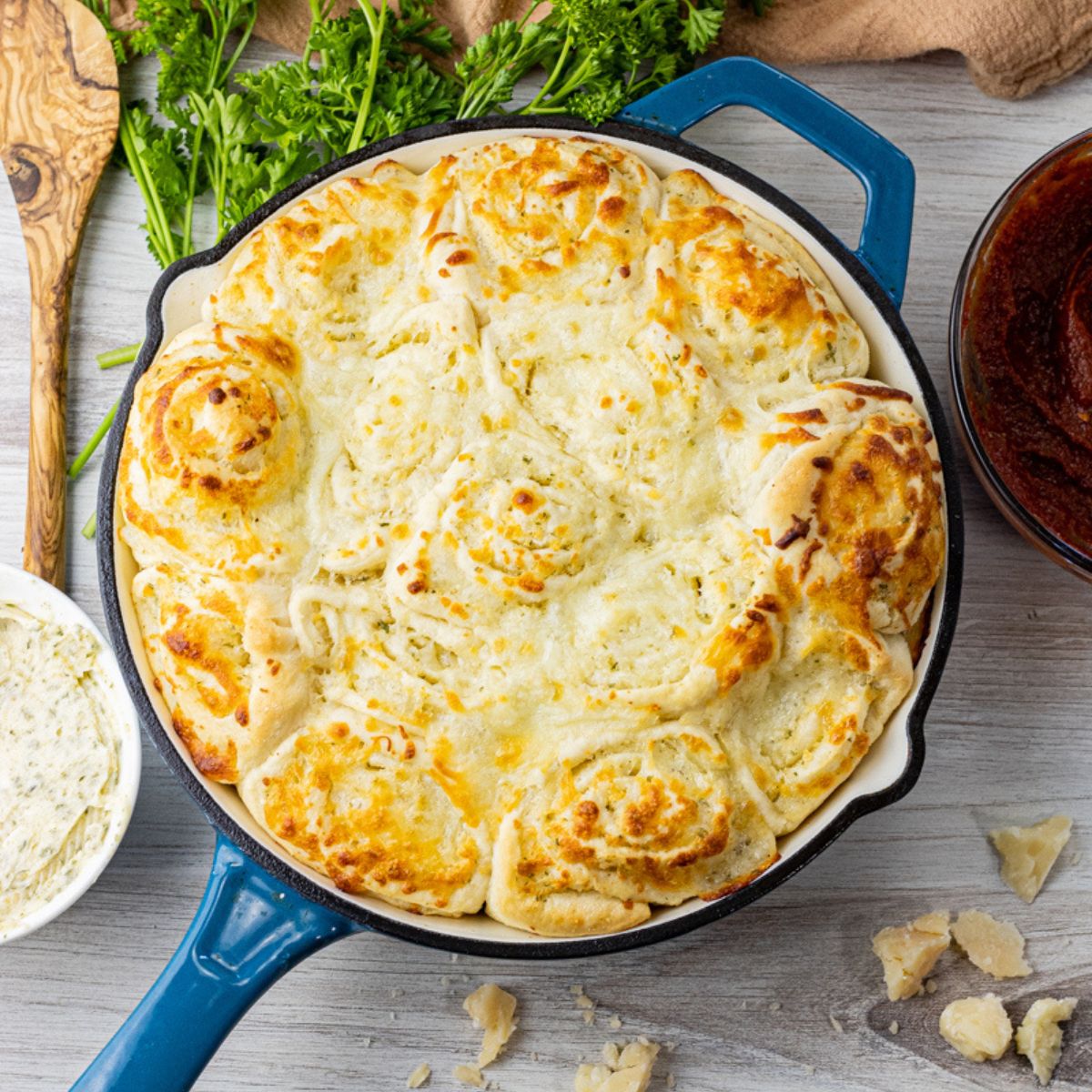 cheesy rolls in a cast iron pan