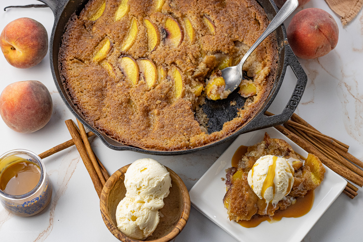 peach cobbler with some spooned out. 